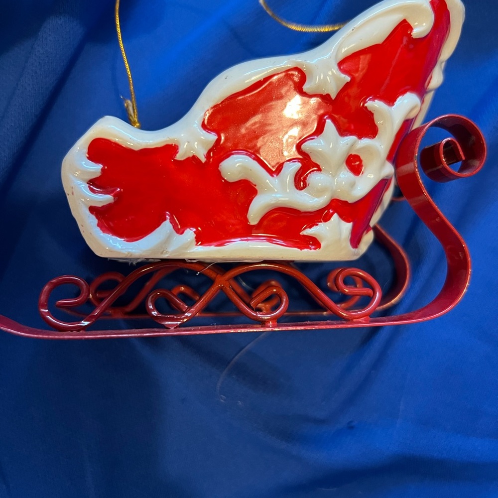 Sleigh ornaments pair selling both ceramic and metal no chips or cracks